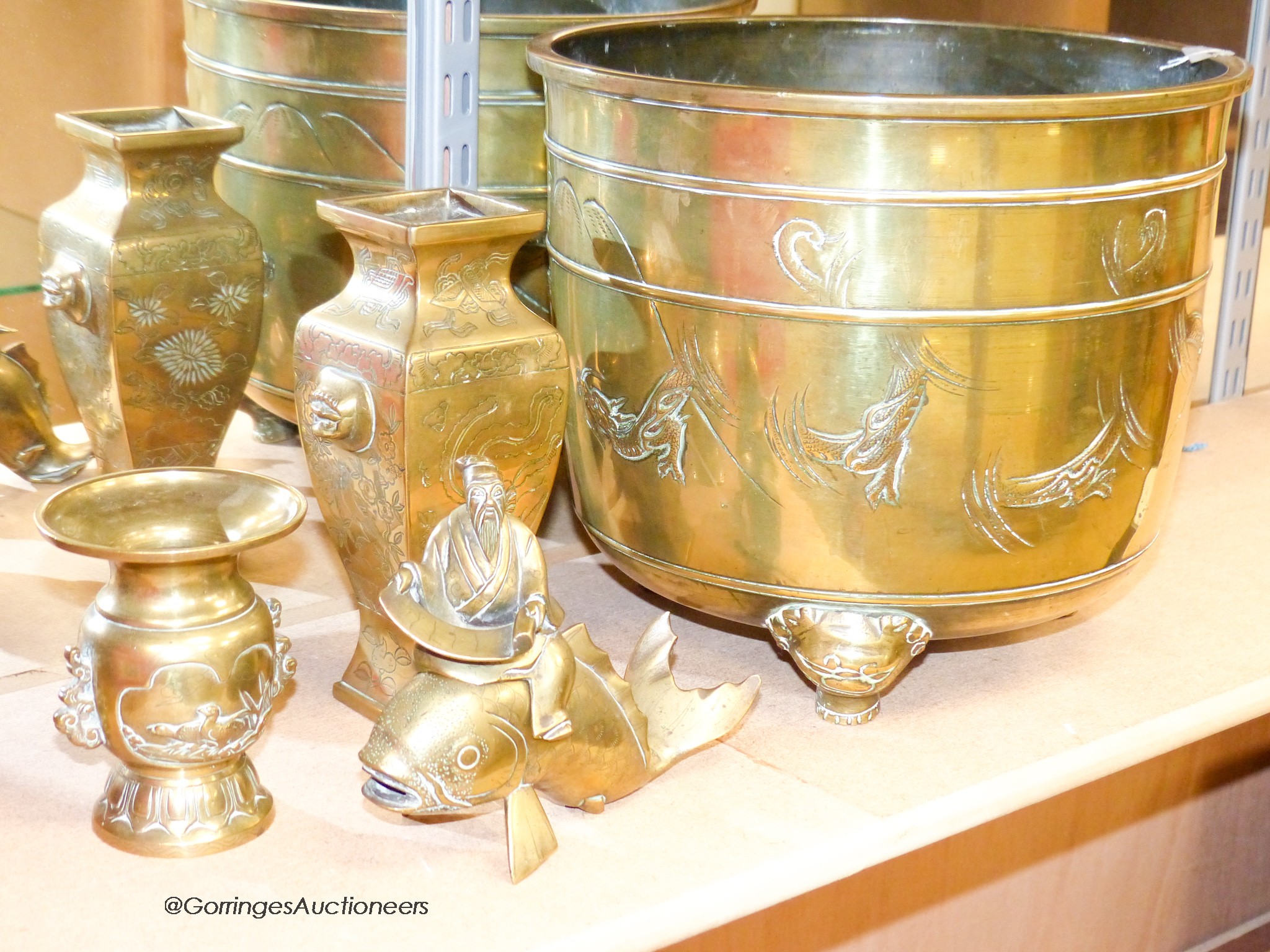 A Japanese brass planter, two vases and a model of kinko riding a carp, tallest 26.5 cm